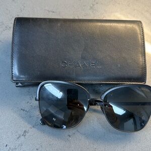 Black Chanel sunglasses with floral trim